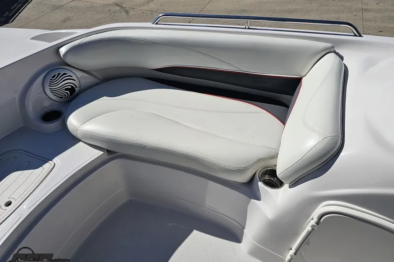 Slide: The Image of 2015 Tahoe 215 Xi boat interior with white cushioned seating and speaker. - 85