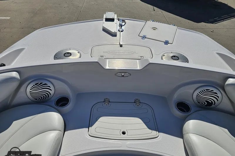 Slide: The Image of 2015 Tahoe 215 Xi boat interior with speakers and seating, showcasing modern design. - 88