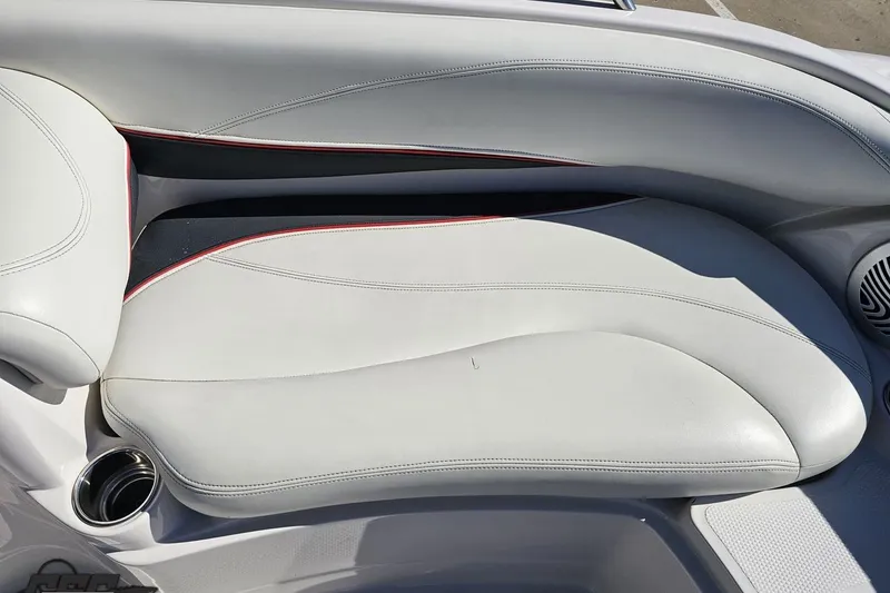 Slide: The Image of 2015 Tahoe 215 Xi boat interior with white leather seating and red accents. - 90