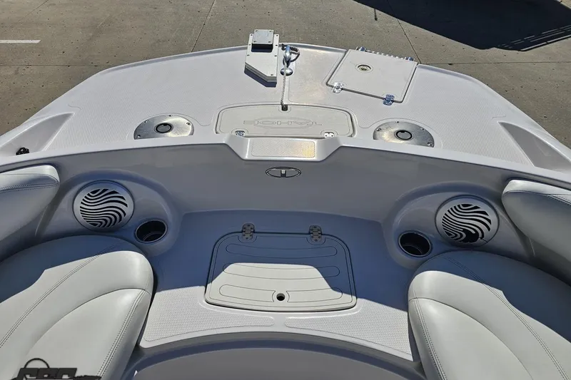 Slide: The Image of Interior view of a 2015 Tahoe 215 Xi boat, featuring speakers and seating. - 93