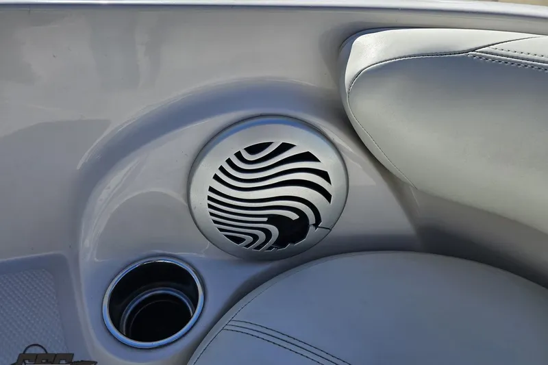 Slide: The Image of Speaker and cup holder in 2015 Tahoe 215 Xi boat interior. - 94