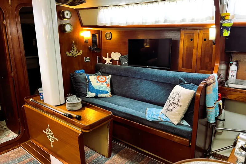 Slide: The Image of Interior of 1985 Gulfstar Hirsch Center Cockpit yacht with cozy seating and nautical decor. - 10