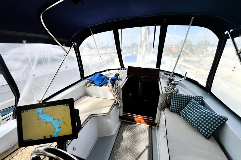 Slide: The Image of 1985 Gulfstar Hirsch Center Cockpit bathroom with sink, toilet, and shower area. - 15