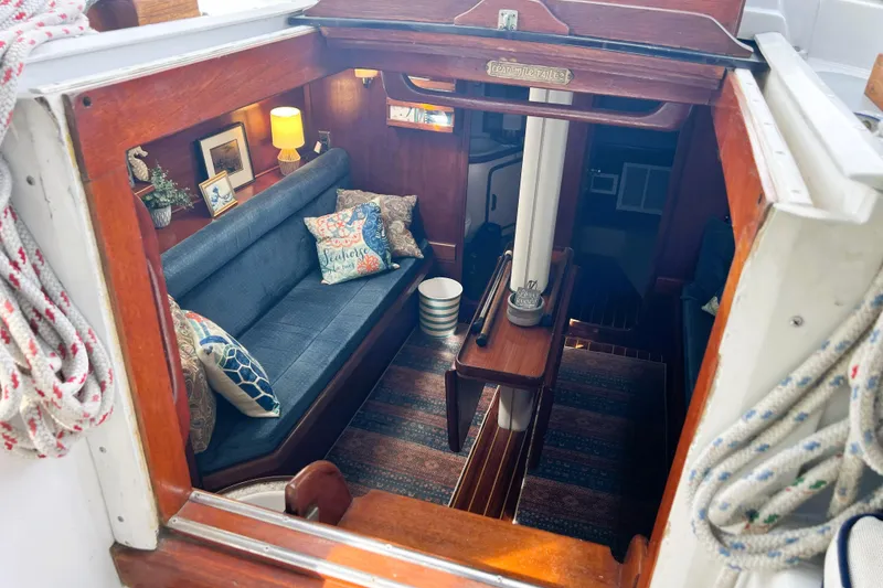 Slide: The Image of 1985 Gulfstar Hirsch Center Cockpit bathroom with marine toilet and wooden seat. - 16