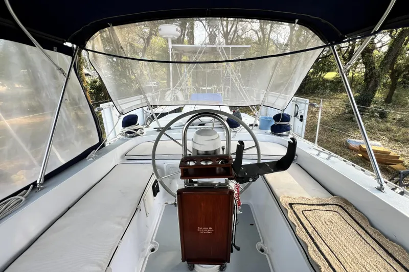 Slide: The Image of 1985 Gulfstar Hirsch Center Cockpit bathroom with sink, mirror, and towel. - 18