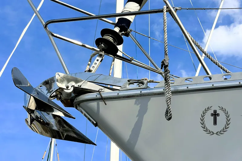 Slide: The Image of Side view of 1985 Gulfstar Hirsch Center Cockpit boat with sleek white and blue hull. - 24