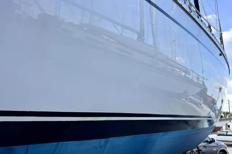 Slide: The Image of 1985 Gulfstar Hirsch Center Cockpit sailboat keel in a wooded boatyard setting. - 25