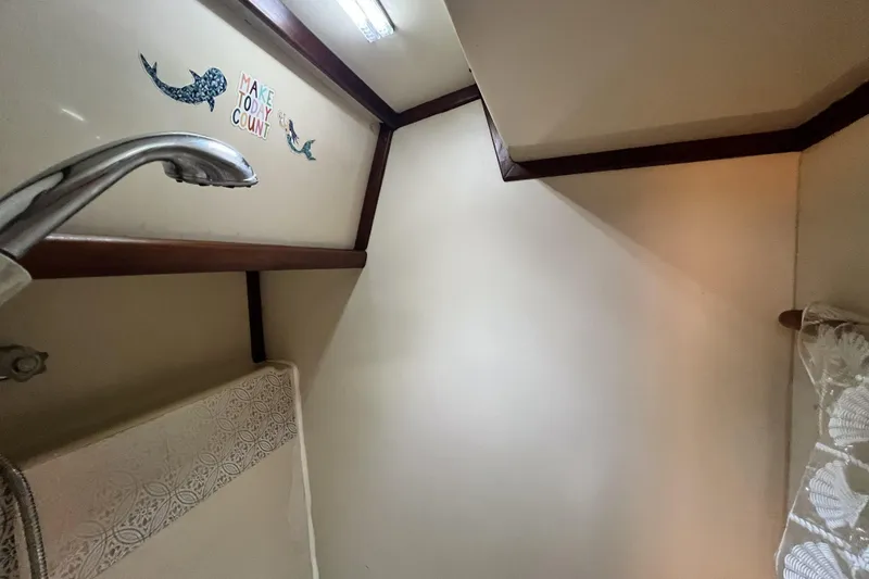 Slide: The Image of Bow of 1985 Gulfstar Hirsch Center Cockpit sailboat with anchor and ropes. - 4