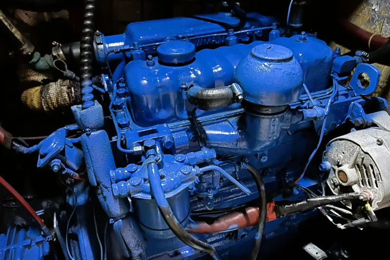 Slide: The Image of 1985 Gulfstar Hirsch Center Cockpit interior with cozy seating, nautical decor, and wooden finishes. - 7