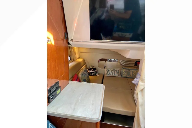 Slide: The Image of Interior of 2012 Regal 35 Express Cruiser with cozy seating and decor. - 20