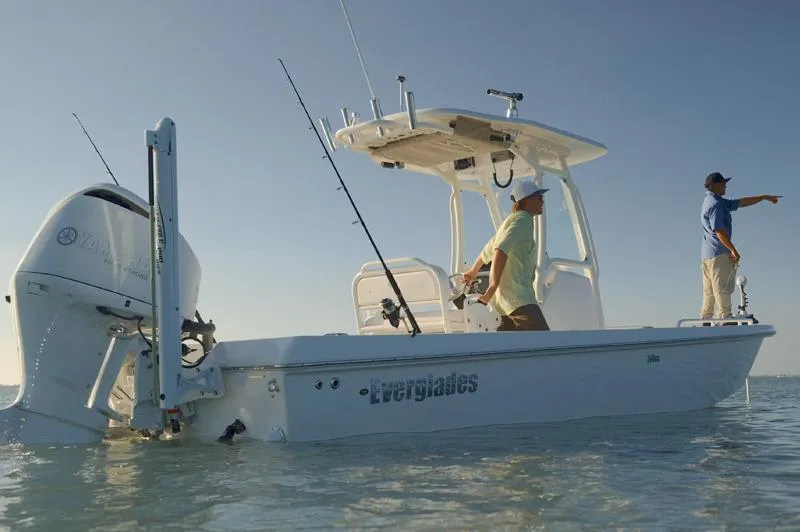Slide: The Image of Manufacturer Provided Image: 2017 Everglades 243 Center Console boat on calm water with two people. - 3