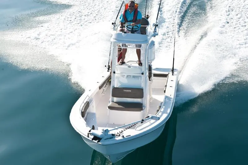Slide: The Image of Manufacturer Provided Image: 2017 Everglades 243 Center Console boat cruising on water. - 4
