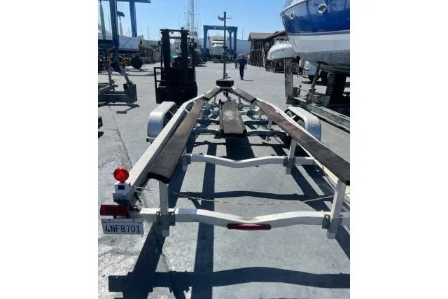 Slide: The Image of Boat trailer for Flying Tiger 10M, 2006 model, parked in a marina. - 10
