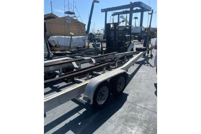 Slide: The Image of Boat trailer at marina with Flying Tiger 10M, 2006 model, in background. - 11