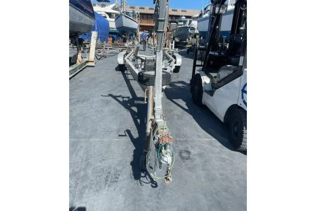 Slide: The Image of Boat mast on ground near forklifts, Flying Tiger 10M, 2006 model. - 12