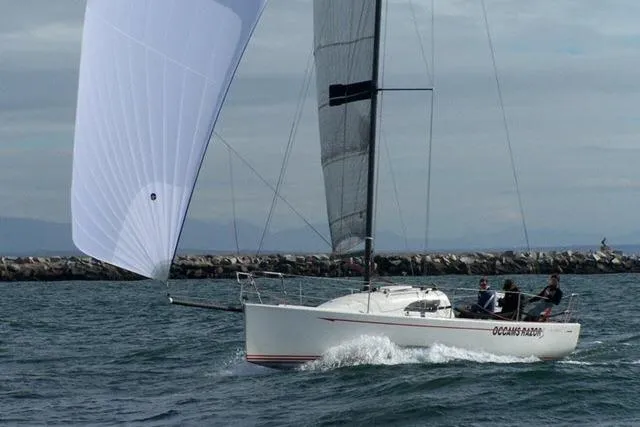 Slide: The Image of Sailing yacht Flying Tiger 10M, 2006 model, gliding on water with full sails. - 13