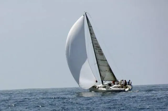 Slide: The Image of Sailing yacht Flying Tiger 10M, 2006 model, gliding on open sea with full sails. - 15