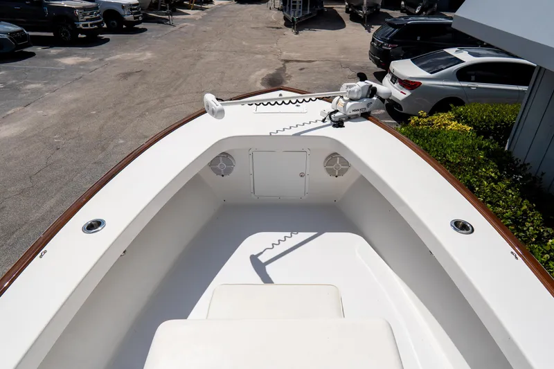 Slide: The Image of Bow view of 2022 Croswait 21 boat with trolling motor, parked in a lot. - 13