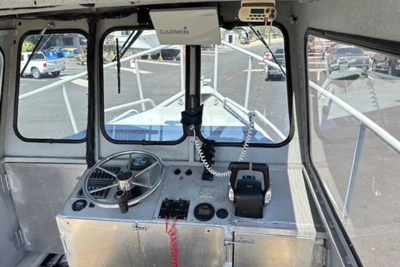 Slide: The Image of Interior view of a 1998 Fishing 22 boat cockpit with Garmin navigation system. - 3