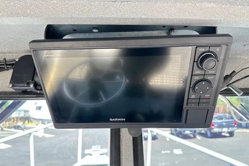 Slide: The Image of Garmin GPS device installed on a 1998 Fishing 22 boat dashboard. - 6