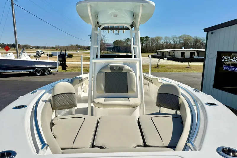 Slide: The Image of 2026 Key West 239 FS boat interior with cushioned seating and modern design. - 10