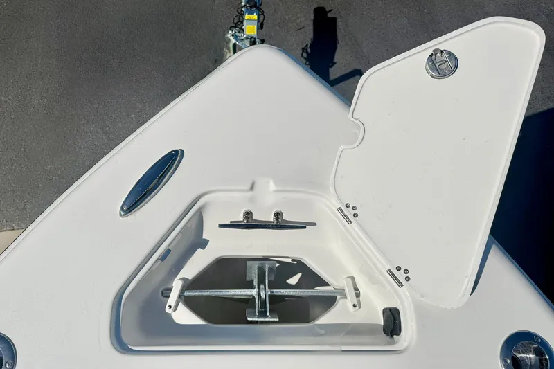 Slide: The Image of Open anchor compartment on 2026 Key West 239 FS boat, showcasing storage space. - 15
