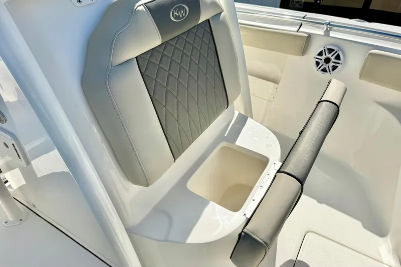Slide: The Image of 2026 Key West 239 FS boat seat with storage compartment and speaker. - 19