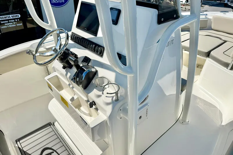Slide: The Image of 2026 Key West 239 FS boat console with steering wheel and controls. - 20