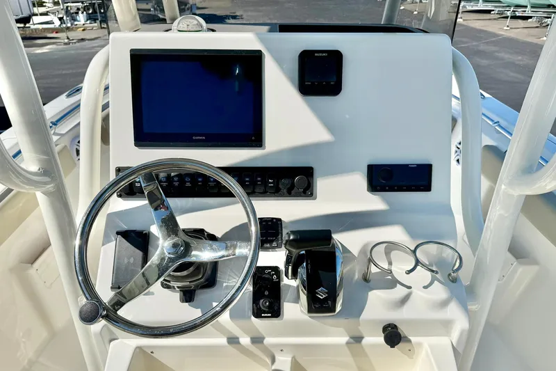 Slide: The Image of Steering console of 2026 Key West 239 FS boat with modern controls and display. - 3