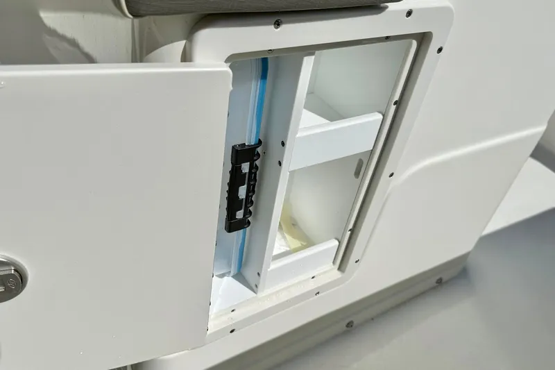 Slide: The Image of Open storage compartment on a 2026 Key West 239 FS boat, showcasing interior shelving. - 30