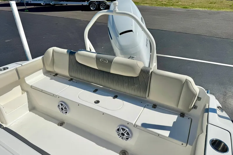 Slide: The Image of 2026 Key West 239 FS boat interior with cushioned seating and built-in speakers. - 34