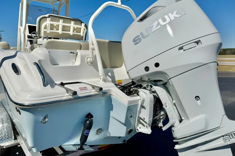 Slide: The Image of 2026 Key West 239 FS boat with Suzuki outboard motor, showcasing sleek design and modern features. - 43