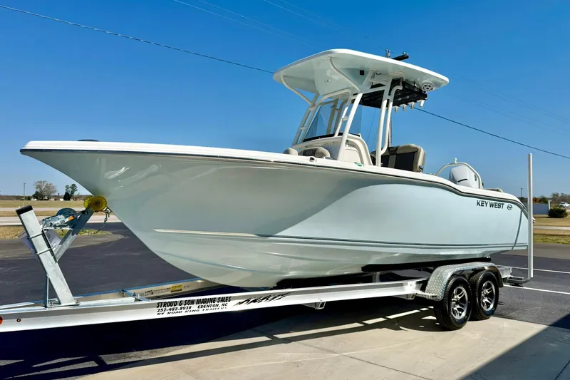 Slide: The Image of 2026 Key West 239 FS boat on trailer under clear blue sky. - 5