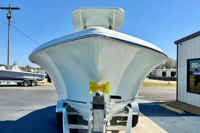 Slide: The Image of 2026 Key West 239 FS boat on trailer, displayed outdoors under clear blue sky. - 8