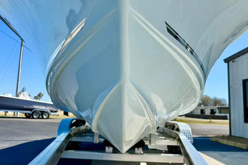 Slide: The Image of 2026 Key West 239 FS boat on trailer, showcasing sleek hull design. - 9