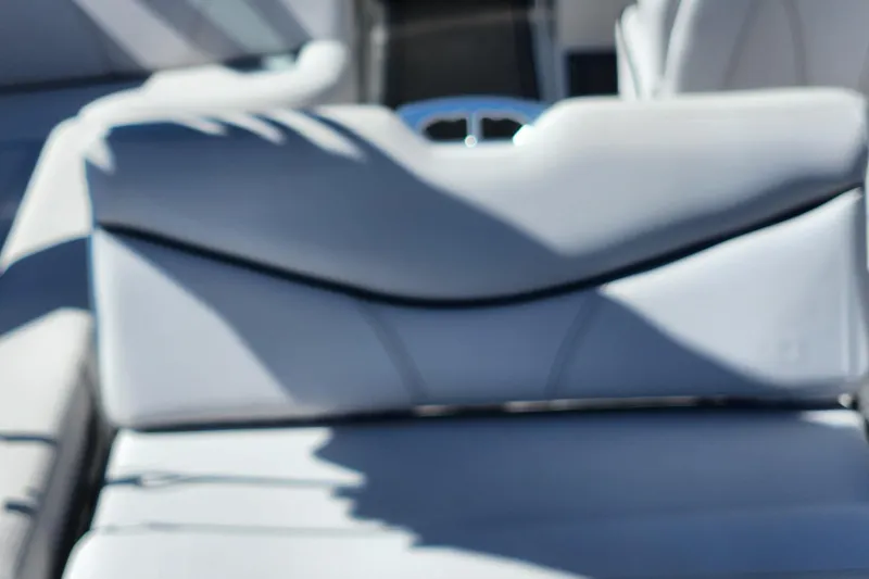 Slide: The Image of 2019 MasterCraft XT22 boat interior with sleek, modern seating design. - 5