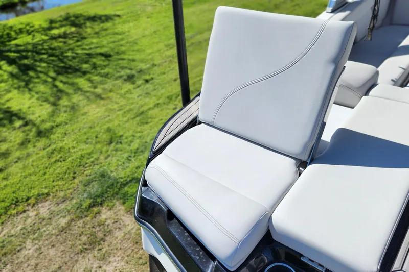 Slide: The Image of 2019 MasterCraft XT22 boat seat with sleek white upholstery and modern design. - 6
