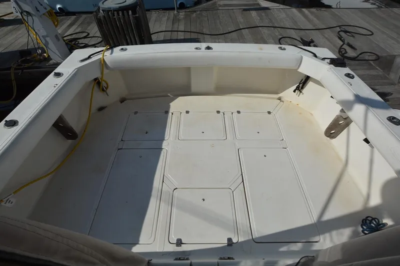 Slide: The Image of 1987 Luhrs Alura 35 boat deck with storage compartments and dockside equipment. - 13