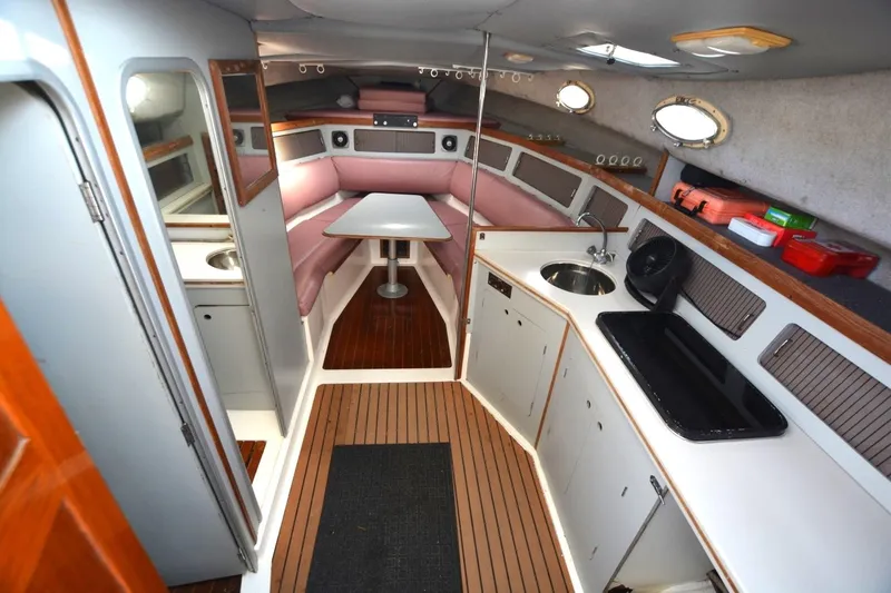 Slide: The Image of Interior of 1987 Luhrs Alura 35 boat with kitchenette and seating area. - 17