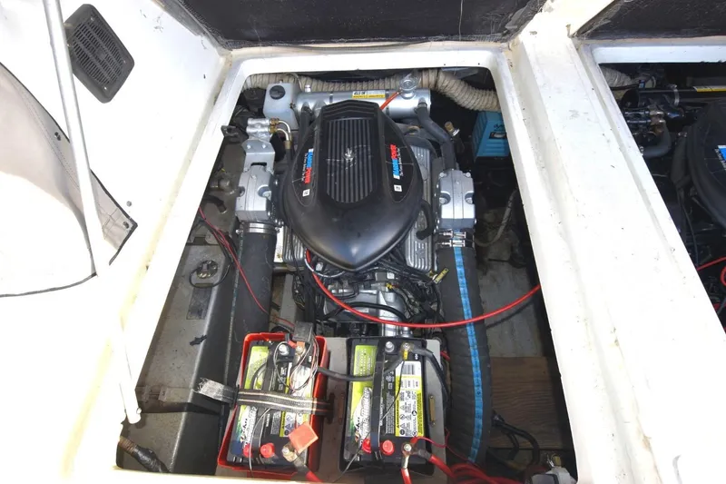 Slide: The Image of Engine compartment of a 1987 Luhrs Alura 35 boat, featuring batteries and wiring. - 24