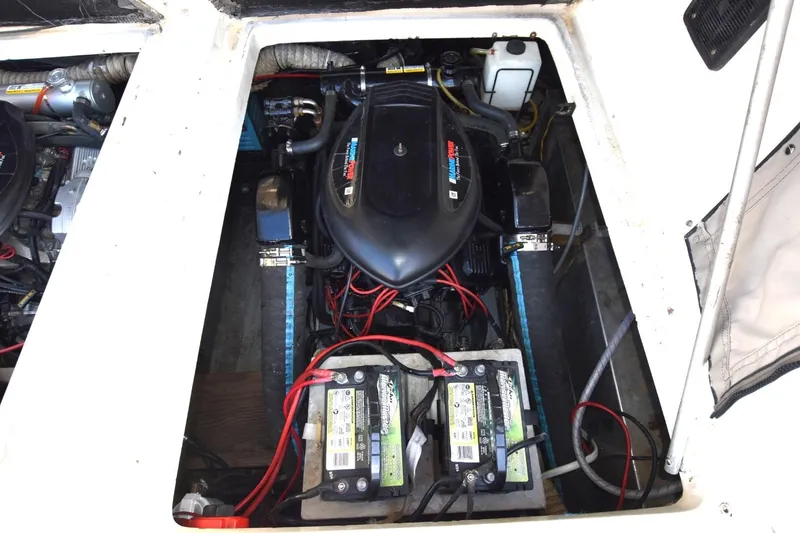 Slide: The Image of Engine compartment of 1987 Luhrs Alura 35 with visible batteries and wiring. - 25