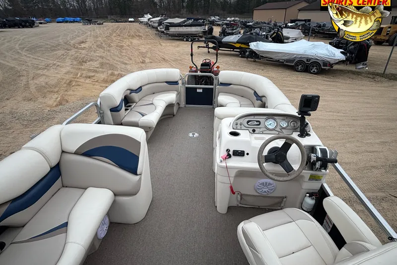 Slide: The Image of 2012 Sylvan 820 Mirage Cruise pontoon boat with spacious seating and modern dashboard. - 11