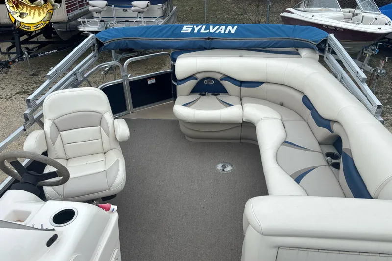 Slide: The Image of 2012 Sylvan 820 Mirage Cruise pontoon boat with spacious seating and steering console. - 7