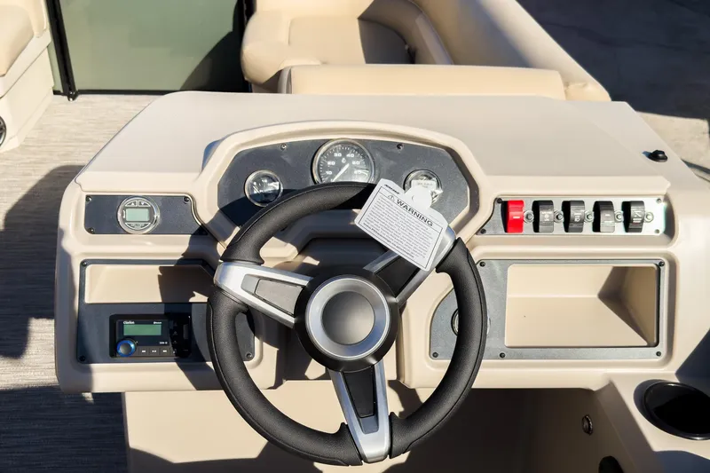 Slide: The Image of Steering console of 2026 Godfrey Sweetwater Xperience 22' Split Bench Tritoon boat. - 17