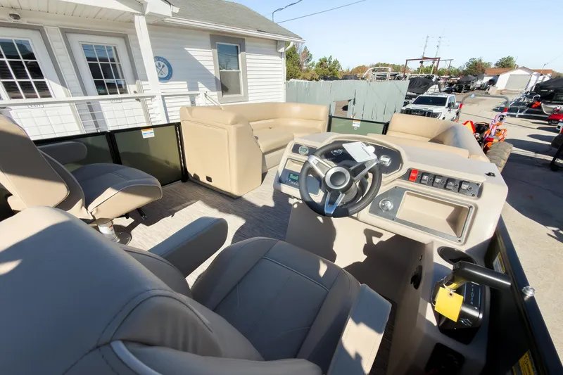 Slide: The Image of 2026 Godfrey Sweetwater Xperience 22' Tritoon interior with split bench seating and modern helm. - 19