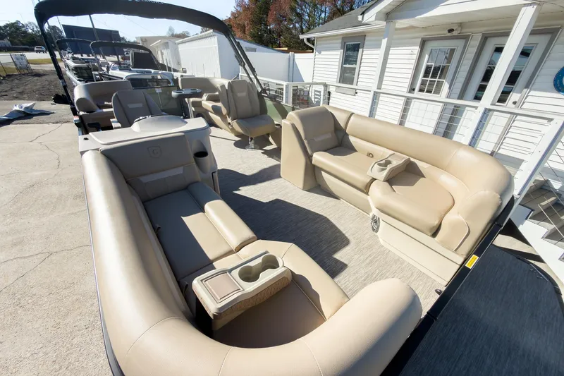 Slide: The Image of 2026 Godfrey Sweetwater Xperience 22' Tritoon with beige split bench seating. - 9