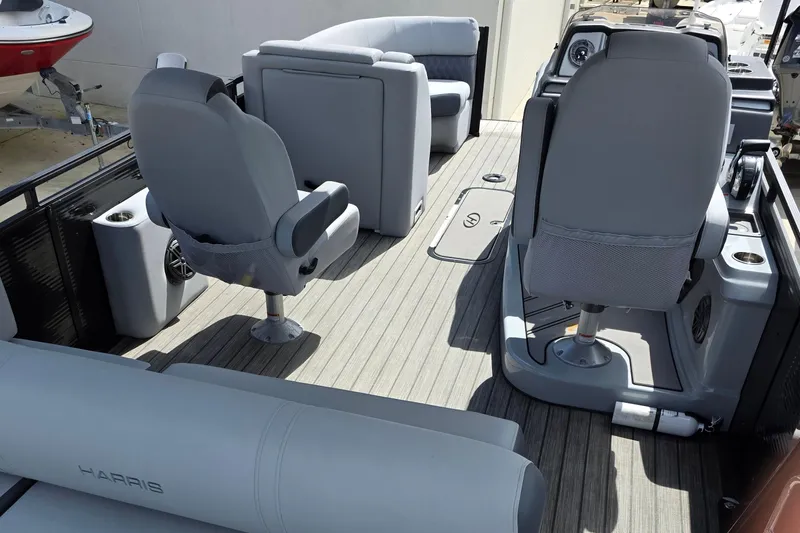 Slide: The Image of 2021 Harris Solstice 230 SL pontoon boat interior with gray seating and modern design. - 10