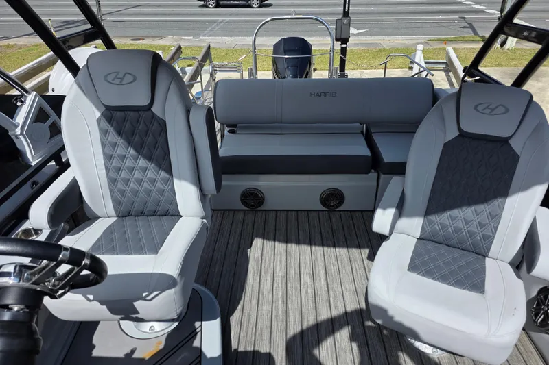 Slide: The Image of 2021 Harris Solstice 230 SL boat interior with gray seating and modern design. - 13