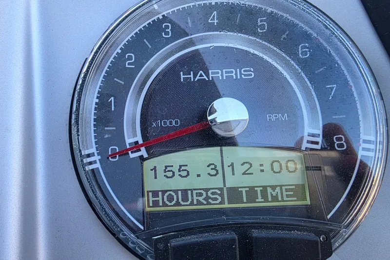 Slide: The Image of Tachometer of 2021 Harris Solstice 230 SL showing 155.3 hours and 12:00 time. - 18
