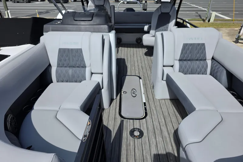 Slide: The Image of 2021 Harris Solstice 230 SL boat interior with luxurious seating and modern design. - 6